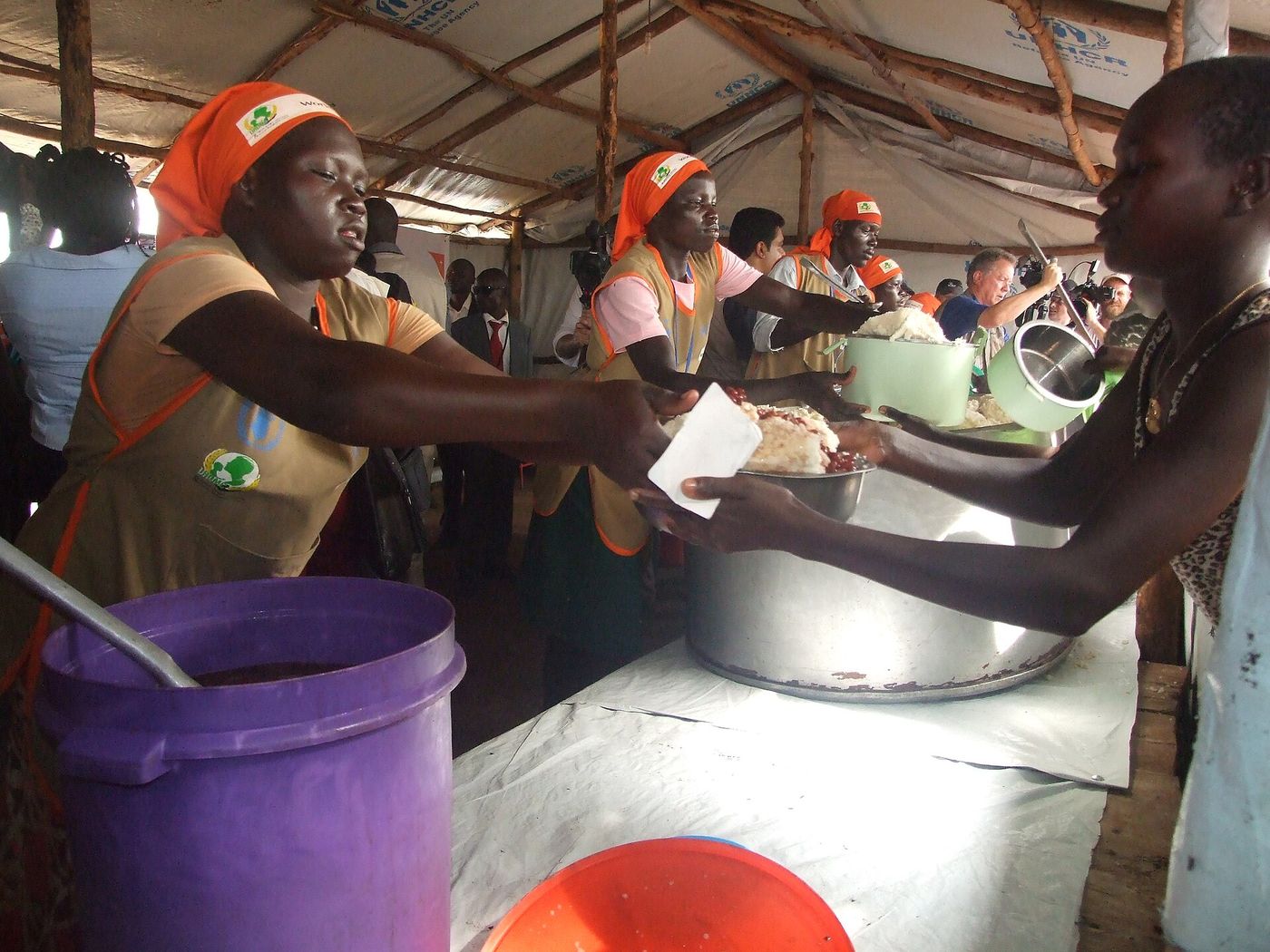 Families being served food at a distribution point