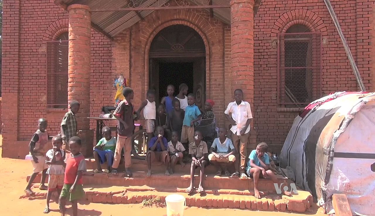 Worshippers outside St. Mary Help of Christians Cathedral in Wau