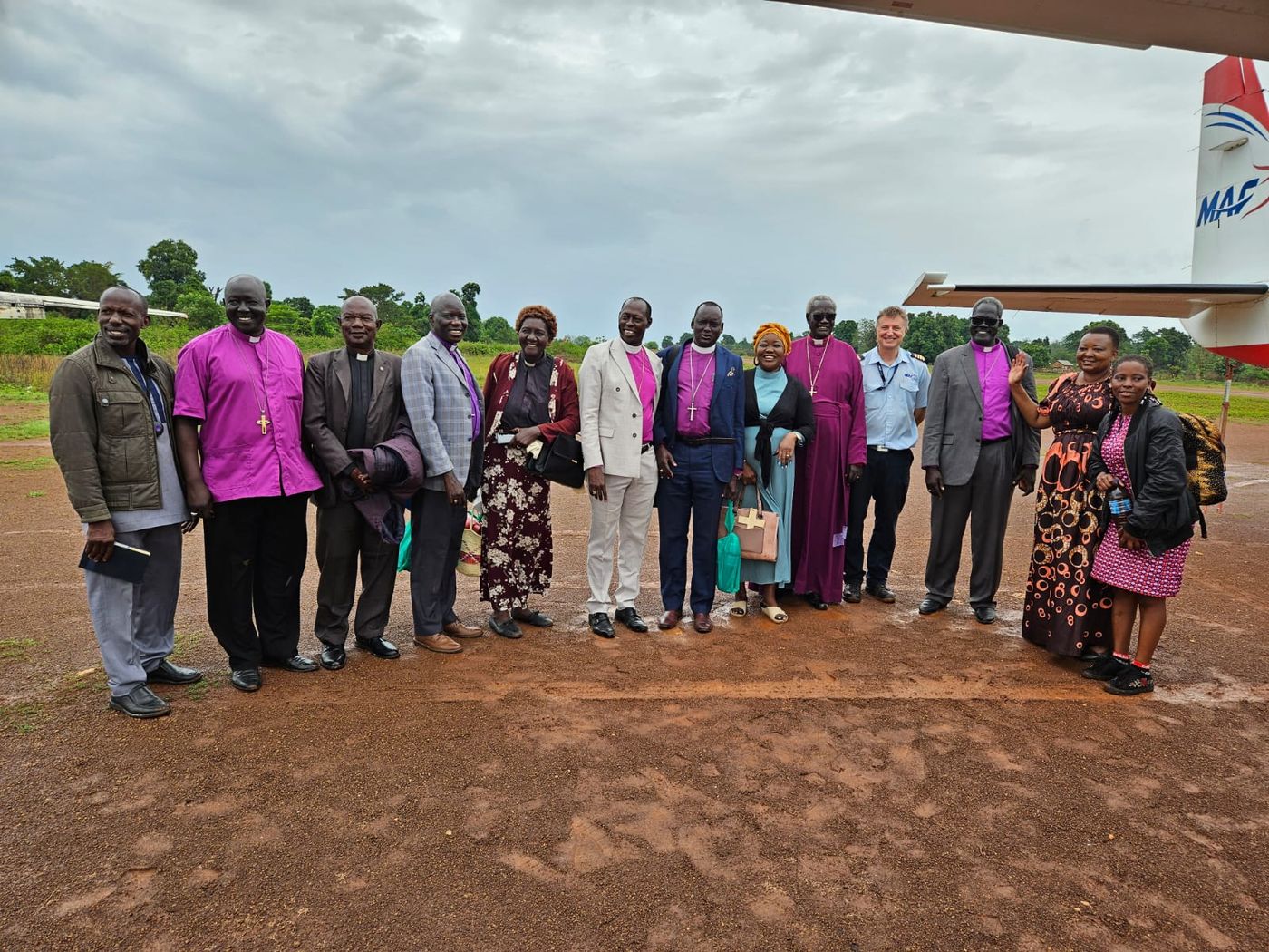 Church leaders arriving for a diocesan visit by mission flight